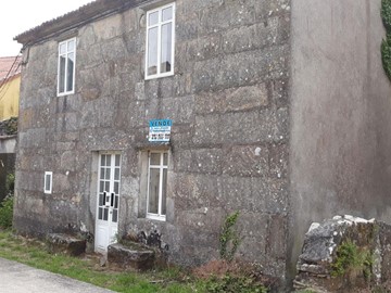 Casa de piedra y pequeña huerta. - Carnota